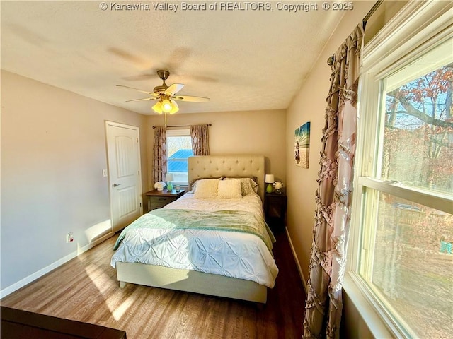 bedroom featuring wood-type flooring and ceiling fan