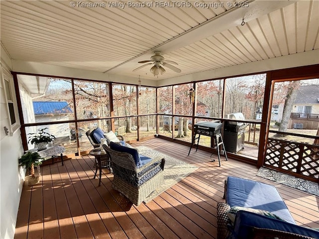 sunroom with ceiling fan and a healthy amount of sunlight