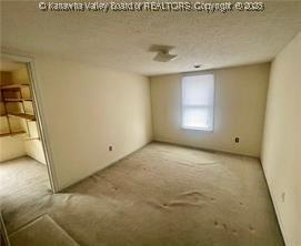 spare room featuring a textured ceiling