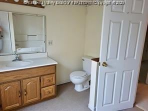 bathroom with vanity and toilet