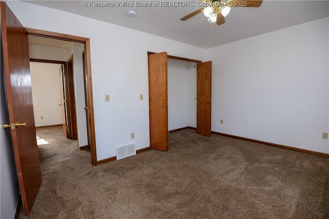 unfurnished bedroom featuring ceiling fan and carpet flooring