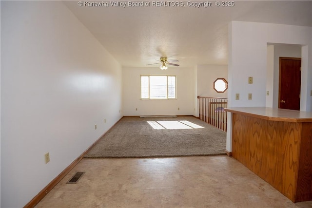 interior space featuring ceiling fan