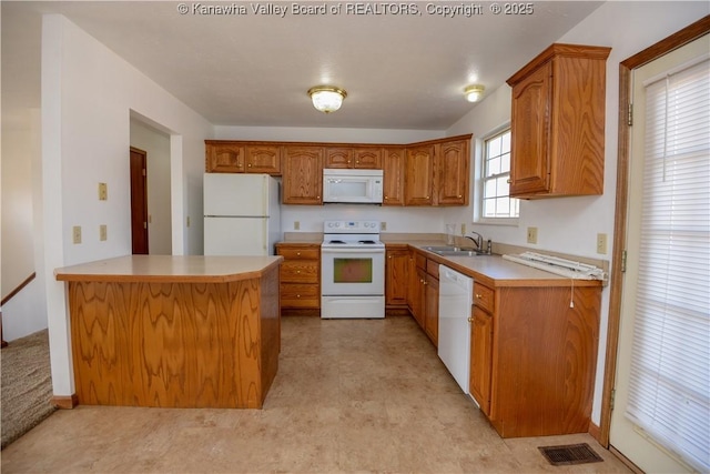 kitchen with sink and white appliances