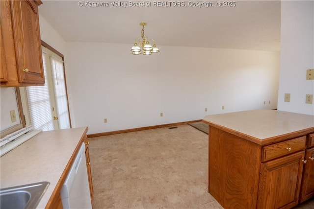 kitchen featuring sink, an inviting chandelier, hanging light fixtures, white dishwasher, and kitchen peninsula