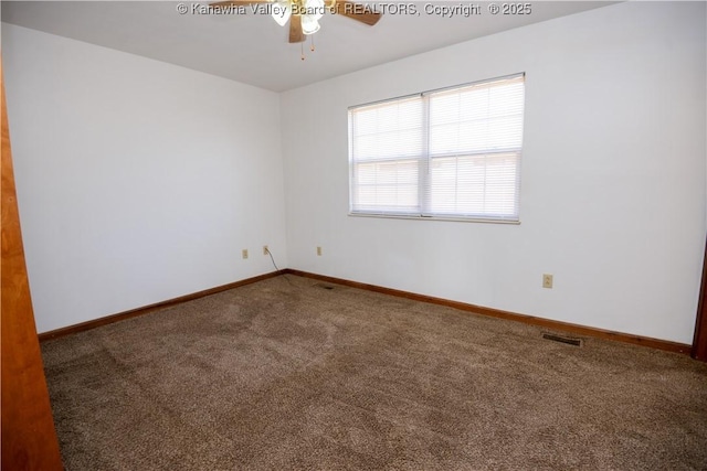 carpeted spare room with ceiling fan