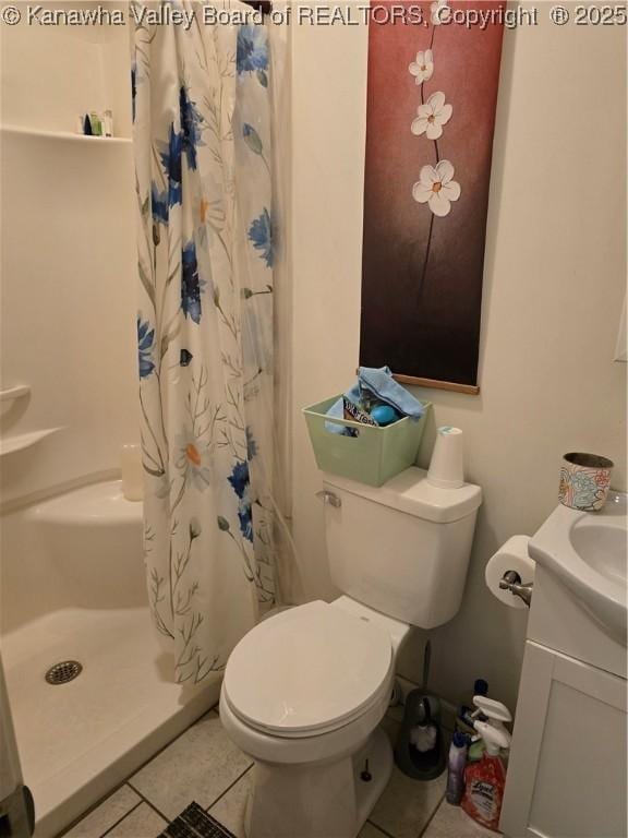 full bathroom with toilet, tile patterned flooring, and a shower with curtain