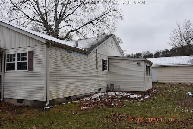 view of home's exterior with a yard