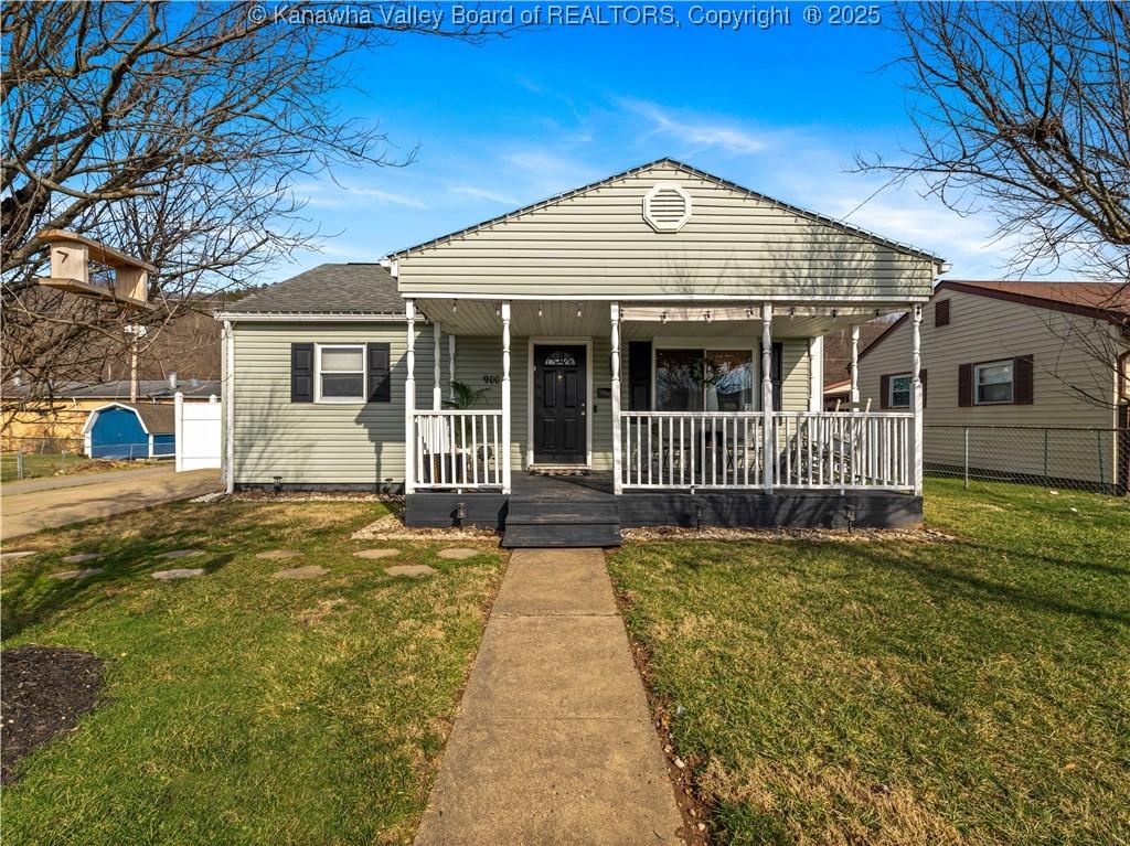 bungalow-style home featuring a porch and a front yard