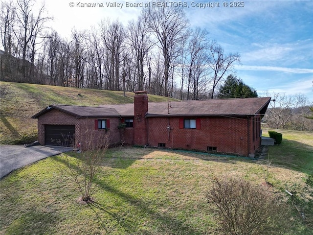 single story home with a garage and a front yard