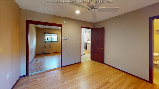 unfurnished bedroom with ceiling fan and light hardwood / wood-style flooring