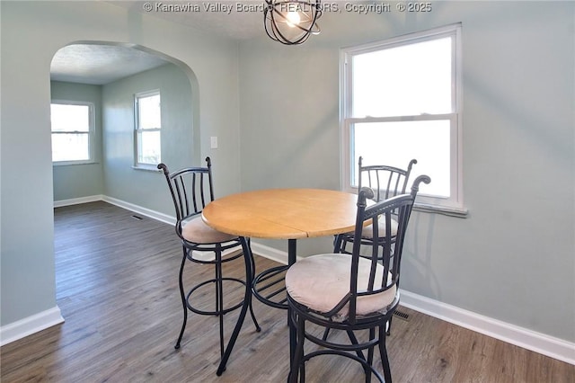 dining room with dark hardwood / wood-style floors