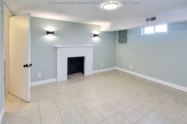 basement with a fireplace and electric panel