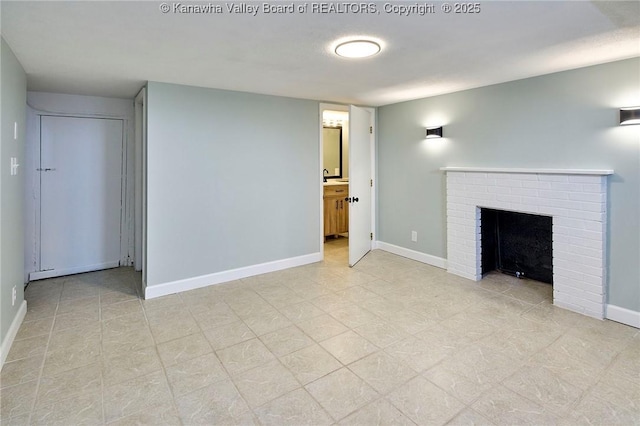 unfurnished living room featuring a brick fireplace