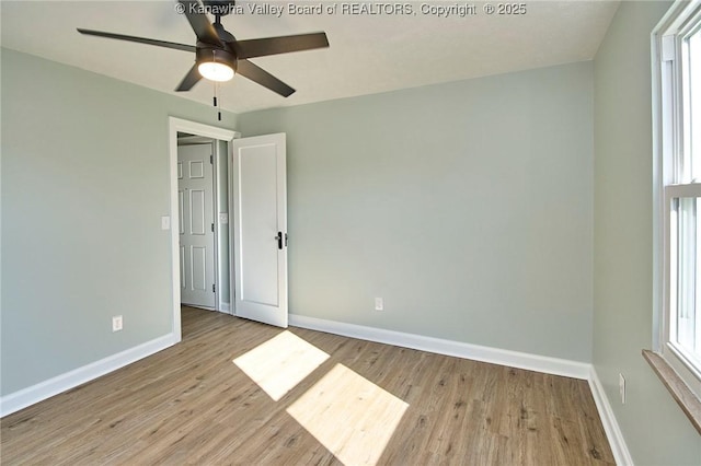 spare room featuring ceiling fan and light hardwood / wood-style flooring