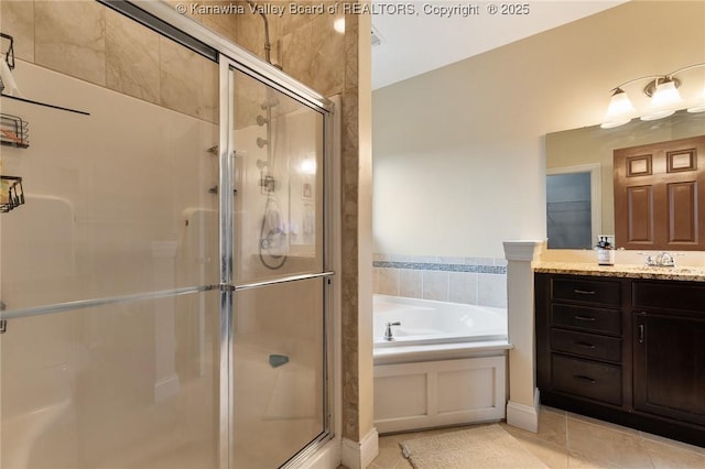 bathroom with plus walk in shower, tile patterned floors, and vanity