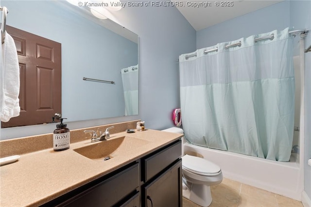 full bathroom featuring vanity, shower / tub combo, tile patterned flooring, and toilet