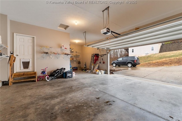 garage featuring a garage door opener