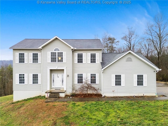 colonial home with a front yard