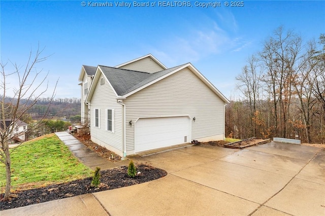 view of side of property featuring a garage