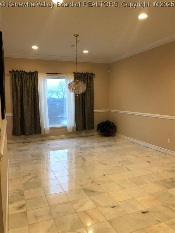 unfurnished room featuring ornamental molding