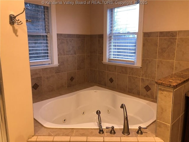 bathroom featuring tiled tub