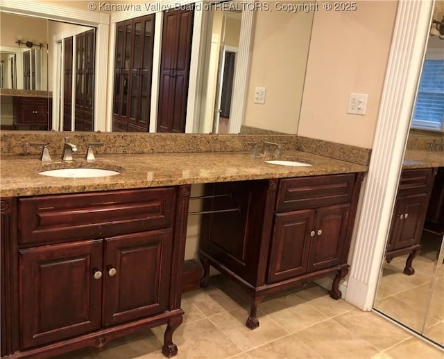 bathroom with vanity and tile patterned floors