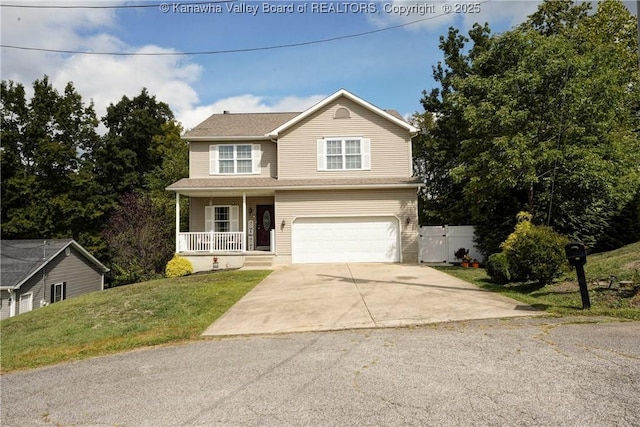 view of property featuring a garage, covered porch, and a front lawn