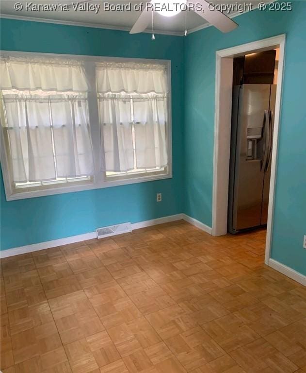 unfurnished room featuring crown molding, ceiling fan, and parquet floors