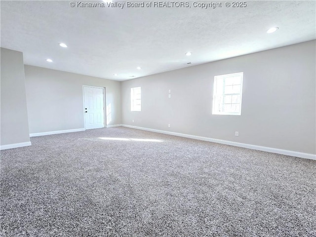 100 Oak Ridge Ln, Huntington, WV 25704 - unfurnished room featuring carpet flooring and a wealth of natural light