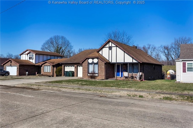 view of front of home featuring a garage and a front lawn