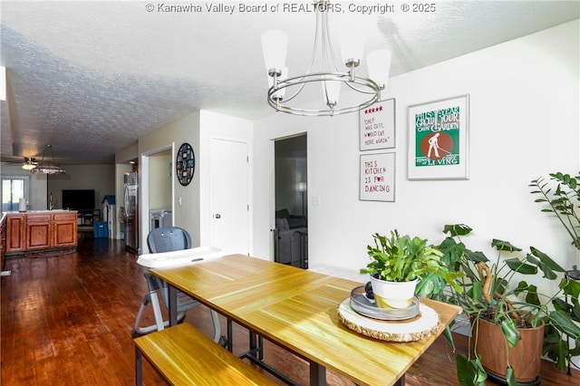 dining room with dark hardwood / wood-style flooring, ceiling fan with notable chandelier, and a textured ceiling