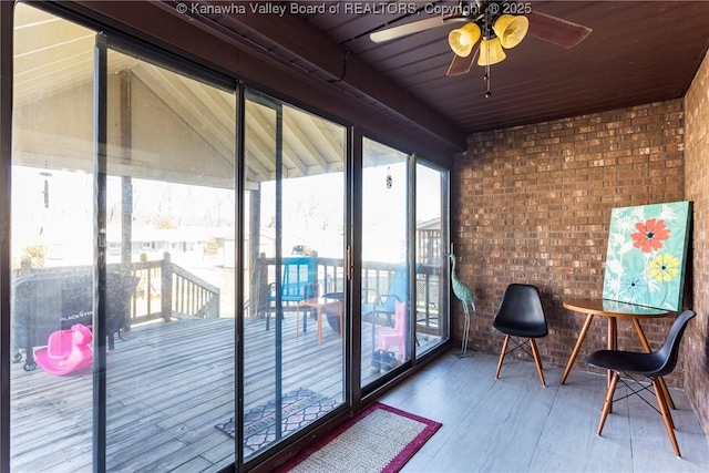 sunroom / solarium with ceiling fan