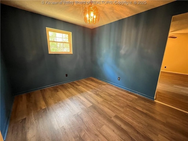 spare room with hardwood / wood-style floors