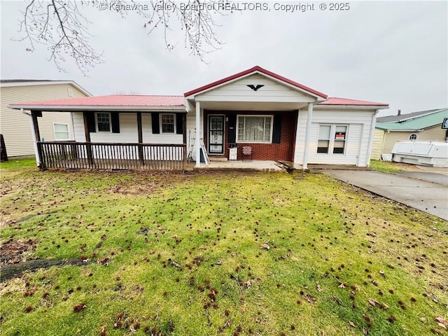 ranch-style home with a porch and a front yard