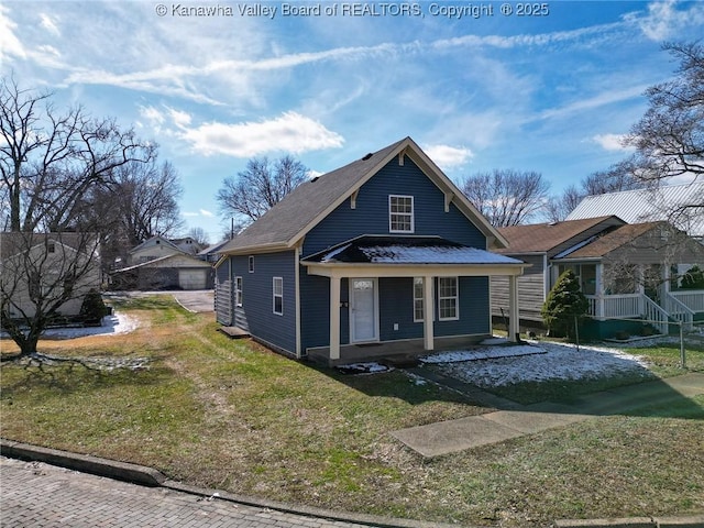 bungalow-style home featuring covered porch and a front yard