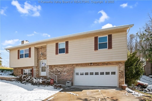 bi-level home featuring a garage