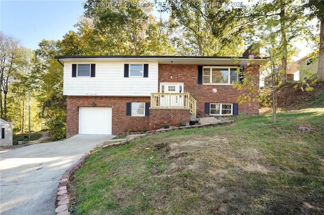 raised ranch featuring a front yard and a garage