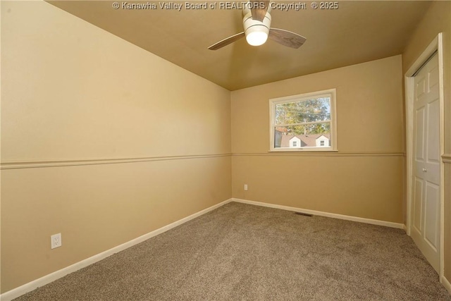 unfurnished room with carpet flooring and ceiling fan