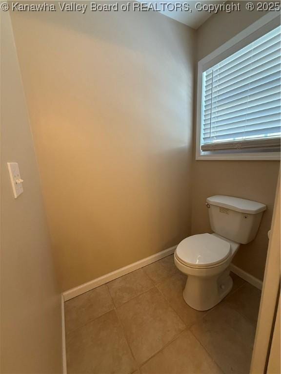 bathroom with tile patterned floors and toilet