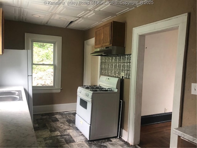 kitchen featuring sink and white appliances