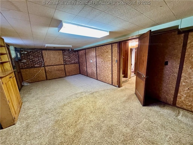 basement featuring light colored carpet