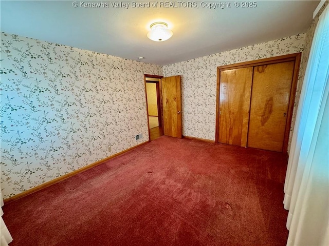 unfurnished bedroom with a closet and carpet floors