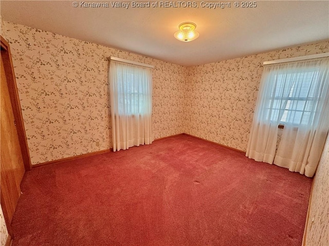 empty room featuring carpet flooring