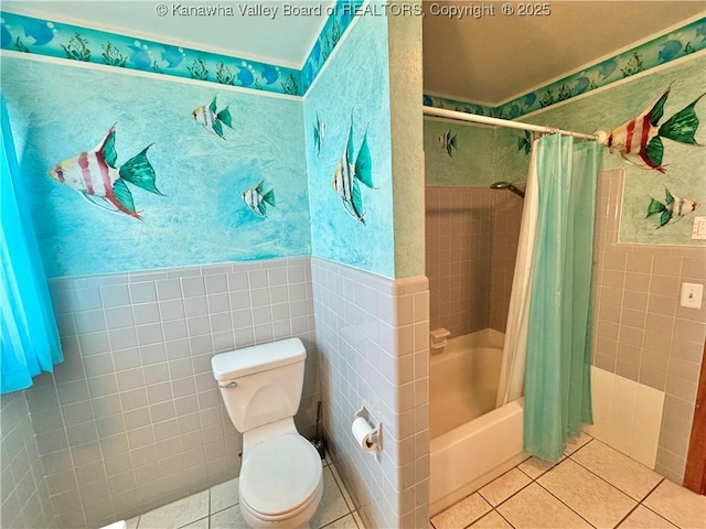 bathroom featuring tile patterned floors, shower / tub combo with curtain, tile walls, and toilet