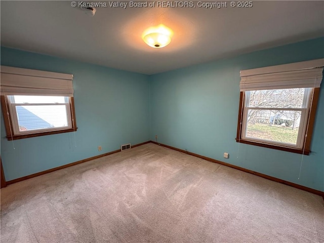 spare room featuring carpet flooring