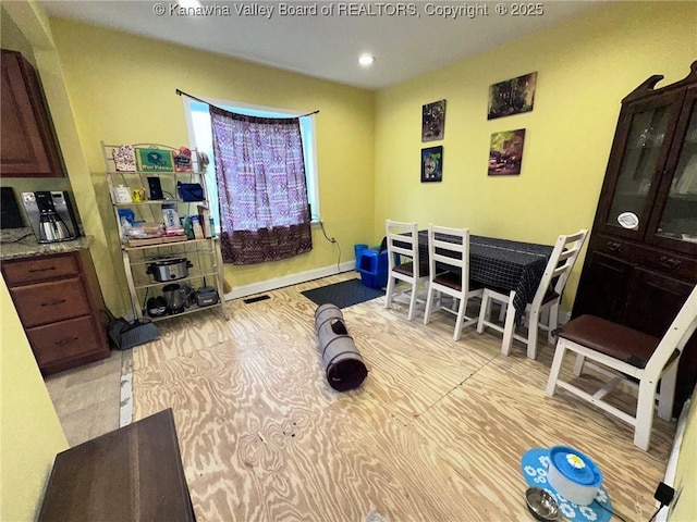 exercise room featuring recessed lighting and baseboards