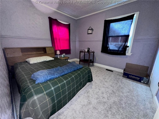 bedroom featuring baseboards, visible vents, ornamental molding, a textured ceiling, and carpet floors