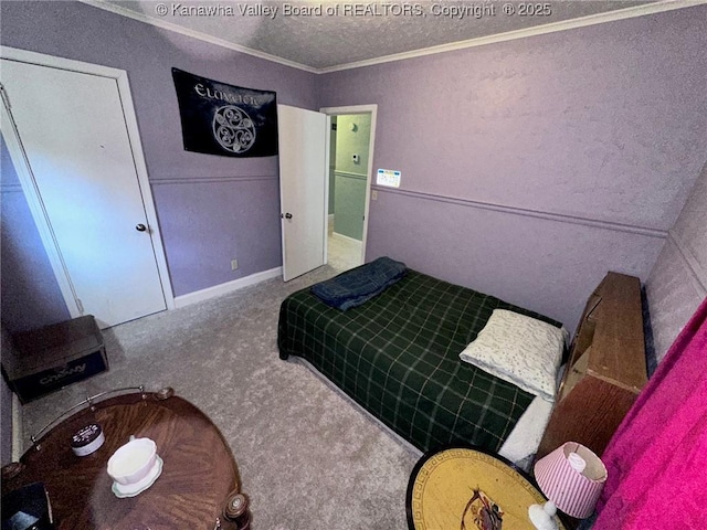 bedroom with a textured ceiling, ornamental molding, and carpet flooring