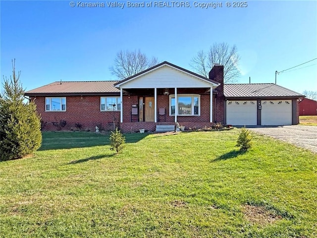 ranch-style house with covered porch, a front lawn, and a garage