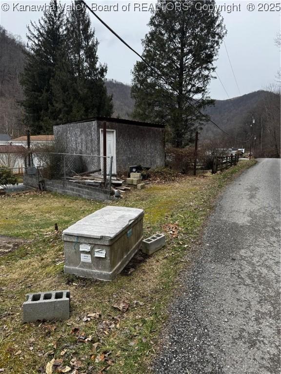 81 Amburgey Ln, Amherstdale, WV 25607 - exterior space featuring fence and a mountain view